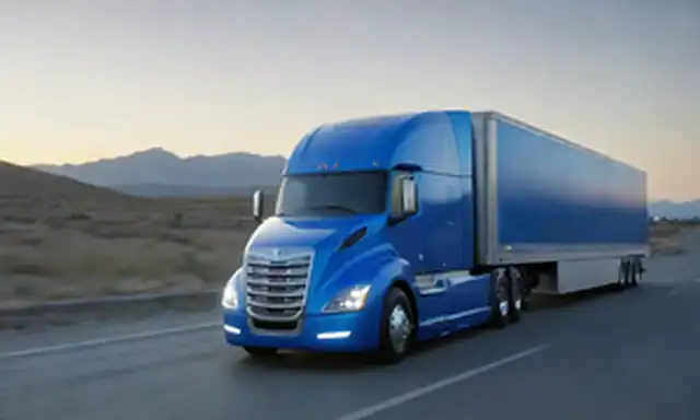 Un camión futurista que conduce en una carretera